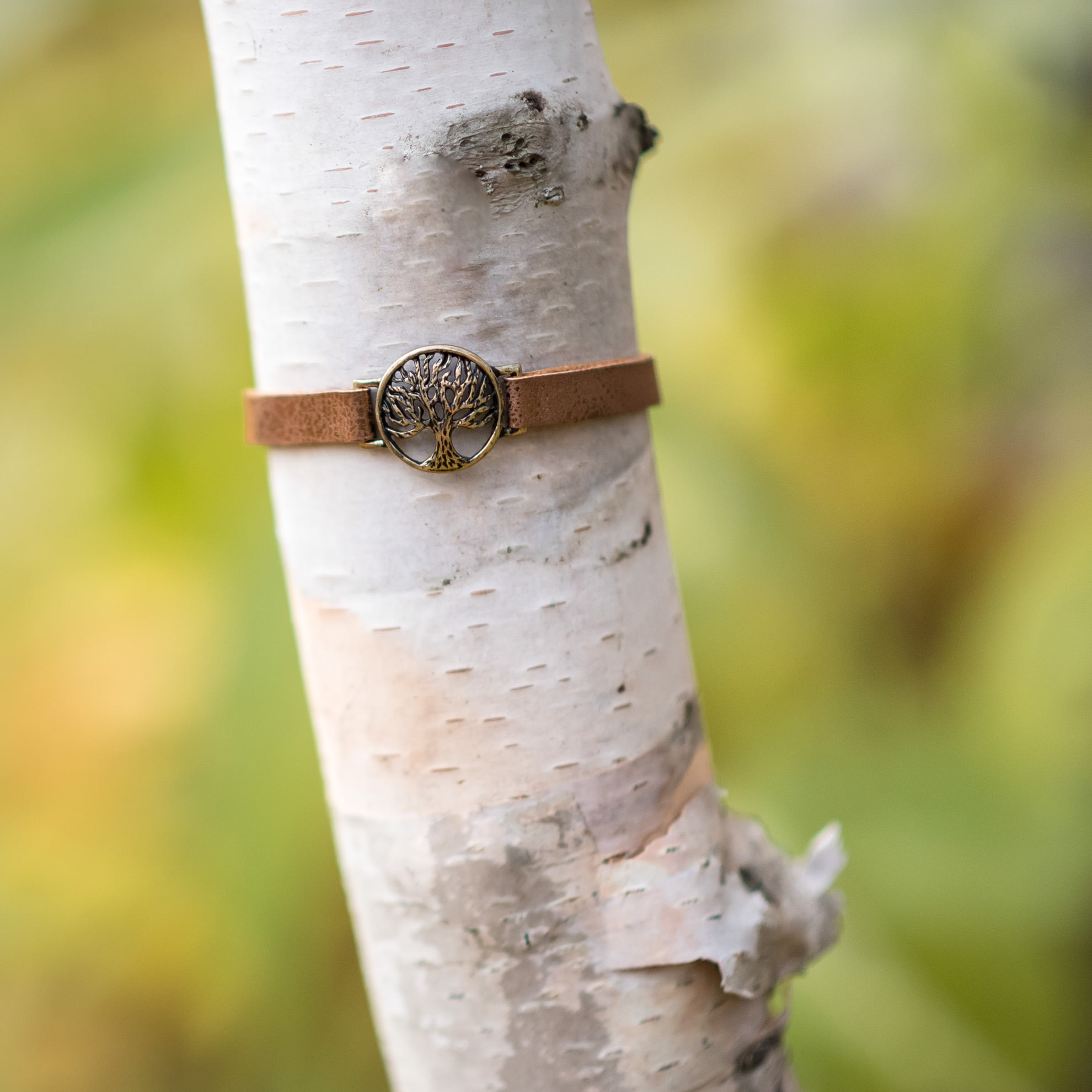 tree pendant bracelet on birch tree branch