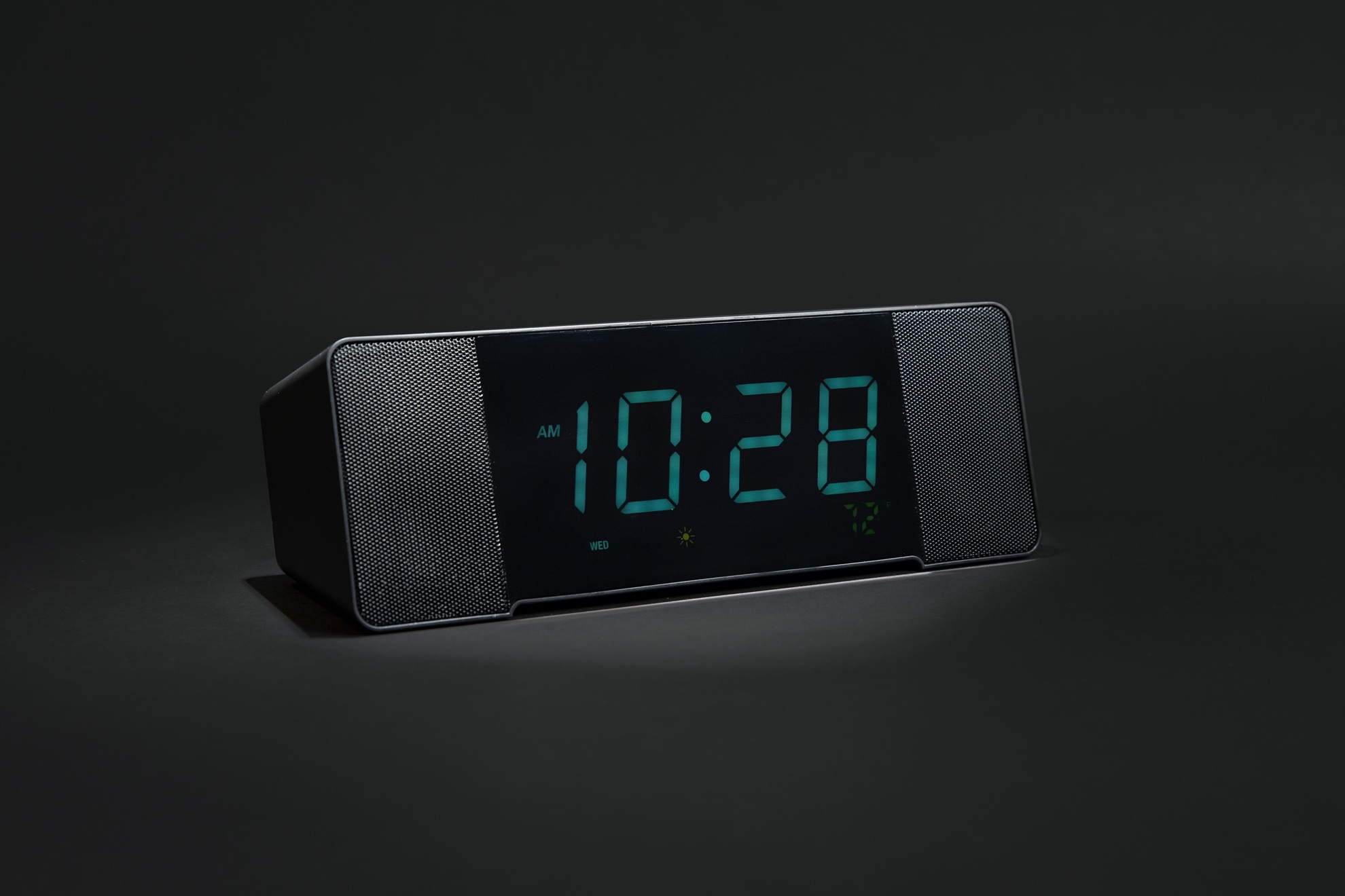 dark and moody product photo of digital clock